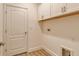 Laundry room with washer/dryer hookups and upper cabinets for storage at 309 Potenza Loop, Nokomis, FL 34275