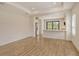 Spacious living area with tile floors opens to the kitchen with bar seating at 309 Potenza Loop, Nokomis, FL 34275