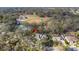 Expansive aerial view of a charming single-Gathering home nestled among mature trees on a well-manicured lot at 3301 River Woods Dr, Parrish, FL 34219