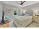 Bedroom features a neutral palette, soft light, and ceiling fan at 3301 River Woods Dr, Parrish, FL 34219