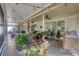 Spacious covered patio with multiple seating areas and beautiful garden views at 3301 River Woods Dr, Parrish, FL 34219