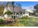 Lovely home with well-kept lawn and mature trees in a desirable neighborhood at 3301 River Woods Dr, Parrish, FL 34219