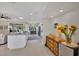 Bright kitchen offering a view of the open-concept living area and modern appliances at 3301 River Woods Dr, Parrish, FL 34219