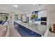 Open kitchen features a large island, stainless appliances, and plenty of natural light from the windows at 3301 River Woods Dr, Parrish, FL 34219