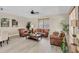 Spacious living room with comfortable seating, tasteful decor, and large windows for natural light at 3301 River Woods Dr, Parrish, FL 34219
