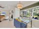 Bright living area features large windows, allowing natural light and views of the lush outdoors, creating a serene atmosphere at 3301 River Woods Dr, Parrish, FL 34219