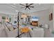 Spacious living room with tile floors, comfortable seating, and open layout to front entrance at 3301 River Woods Dr, Parrish, FL 34219