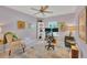 Bright office space with artwork, ample natural light, and a comfortable chair at 3301 River Woods Dr, Parrish, FL 34219