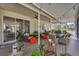 Inviting screened patio with comfortable seating, ceiling fans, and lush greenery at 3301 River Woods Dr, Parrish, FL 34219
