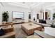 Well-lit living room boasting modern decor, stylish furniture, and a large flat-screen TV at 355 W Royal Flamingo Dr, Sarasota, FL 34236