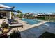 Relaxing pool area with lounge chairs and views of the water, perfect for enjoying the Florida sunshine at 355 W Royal Flamingo Dr, Sarasota, FL 34236