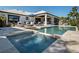 Inviting backyard features a luxurious pool and spa with an outdoor living area perfect for entertaining at 355 W Royal Flamingo Dr, Sarasota, FL 34236