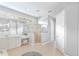 Spacious bathroom with large vanity, shower, makeup area, and plenty of natural light at 4245 Corso Venetia Blvd, Venice, FL 34293