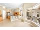 Bright, open kitchen with an adjacent living space and natural light at 4245 Corso Venetia Blvd, Venice, FL 34293