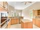 Bright kitchen featuring granite counters, stainless steel appliances, and an island at 4245 Corso Venetia Blvd, Venice, FL 34293