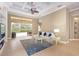 Living area features a view of the outdoor pool and patio, filled with natural light at 4245 Corso Venetia Blvd, Venice, FL 34293