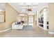 Spacious living room features tile floors, built-in shelving, and a decorative ceiling at 4245 Corso Venetia Blvd, Venice, FL 34293