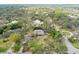 Secluded home nestled among a canopy of mature trees at 4931 Hidden Oaks Trl, Sarasota, FL 34232