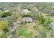 Aerial view of a house surrounded by trees at 4931 Hidden Oaks Trl, Sarasota, FL 34232