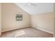 Light-filled room features neutral paint, plush carpet and a sunny window at 4931 Hidden Oaks Trl, Sarasota, FL 34232