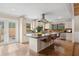Modern kitchen with a center island, stainless steel appliances, and stylish bar stool seating at 4931 Hidden Oaks Trl, Sarasota, FL 34232