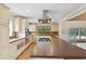 Bright kitchen featuring a large island cooktop, stainless steel appliances, and ample counter space at 4931 Hidden Oaks Trl, Sarasota, FL 34232
