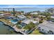 Waterfront home with a private dock and backyard oasis featuring a pool, spa, and beautifully landscaped grounds at 504 Bayview Dr, Holmes Beach, FL 34217