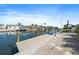 Waterfront property with a private dock, boat lift, and canal views at 504 Bayview Dr, Holmes Beach, FL 34217