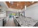 Beautiful open kitchen area with a large center island, modern lighting, and open to other living spaces at 504 Bayview Dr, Holmes Beach, FL 34217
