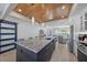 Spacious open-concept kitchen with a large island, stainless steel appliances, and access to the living room at 504 Bayview Dr, Holmes Beach, FL 34217