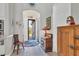 Welcoming foyer with tiled floors, classic furnishings, and a view of the front yard at 5230 Title Row Dr, Bradenton, FL 34210