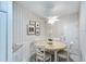 Cozy dining nook with white walls and a chandelier at 5642 Garden Lakes Dr, Bradenton, FL 34203