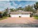 Inviting home showcasing a brick driveway and spacious two-car garage, ideal for comfortable parking at 5642 Garden Lakes Dr, Bradenton, FL 34203