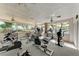 Bright fitness center with an array of exercise equipment and views of the pool at 5642 Garden Lakes Dr, Bradenton, FL 34203