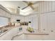 Bright, updated kitchen featuring an island, white cabinets, and modern appliances at 5642 Garden Lakes Dr, Bradenton, FL 34203