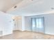 Bright, open living room with wood floors and ample natural light, perfect for relaxation and entertaining at 5642 Garden Lakes Dr, Bradenton, FL 34203