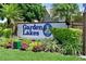 Community sign with lush landscaping at 5642 Garden Lakes Dr, Bradenton, FL 34203