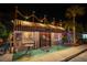 Exterior view of Harry's Grill with festive lighting and a charming ambiance for evening dining at 5807 De Palmas Ave, Holmes Beach, FL 34217