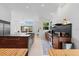 Modern kitchen featuring a large island, stainless steel appliances, and an abundance of natural light at 6504 Virginia Xing, University Park, FL 34201