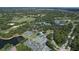 Aerial view of extensive tennis courts, croquet field, and beautiful landscaping in community at 6612 Saint James Xing, University Park, FL 34201