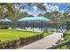 Picturesque common area featuring shaded seating and manicured landscaping for relaxation and socializing at 6612 Saint James Xing, University Park, FL 34201