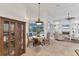 Charming dining area with a view of the pool, creating a relaxed atmosphere for meals at 6612 Saint James Xing, University Park, FL 34201
