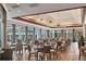 Elegant dining area with stylish decor, ample seating, and plenty of natural light perfect for any occasion at 6612 Saint James Xing, University Park, FL 34201