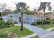 A home featuring a paver driveway and immaculate landscaping, creating an inviting curb appeal at 6612 Saint James Xing, University Park, FL 34201