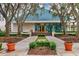 Inviting community center featuring well-manicured landscaping, a charming walkway, and a welcoming entrance at 6612 Saint James Xing, University Park, FL 34201