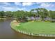 Scenic golf course with lush green, and views of the water and surrounding community. Perfect for a relaxing day at 6612 Saint James Xing, University Park, FL 34201