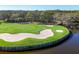 Scenic waterfront golf course with lush green, sand traps, and views of the water and surrounding community at 6612 Saint James Xing, University Park, FL 34201