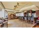 Luxurious clubhouse featuring comfortable seating, a fireplace, and bar with scenic views of the grounds at 6612 Saint James Xing, University Park, FL 34201