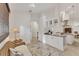 Bright kitchen area with an open layout, granite countertop and stainless steel appliances at 6612 Saint James Xing, University Park, FL 34201