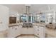 Spacious island with a cooktop and granite countertop, perfect for food preparation and entertaining at 6612 Saint James Xing, University Park, FL 34201